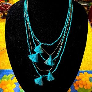 Turquoise and Bronze mini beaded, multi stranded long fashionable necklace.